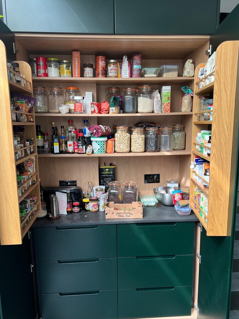 Dark green larder with an oak interior