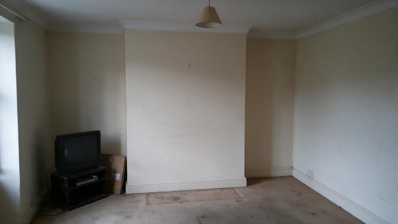Before: Two alcoves, one wall of books